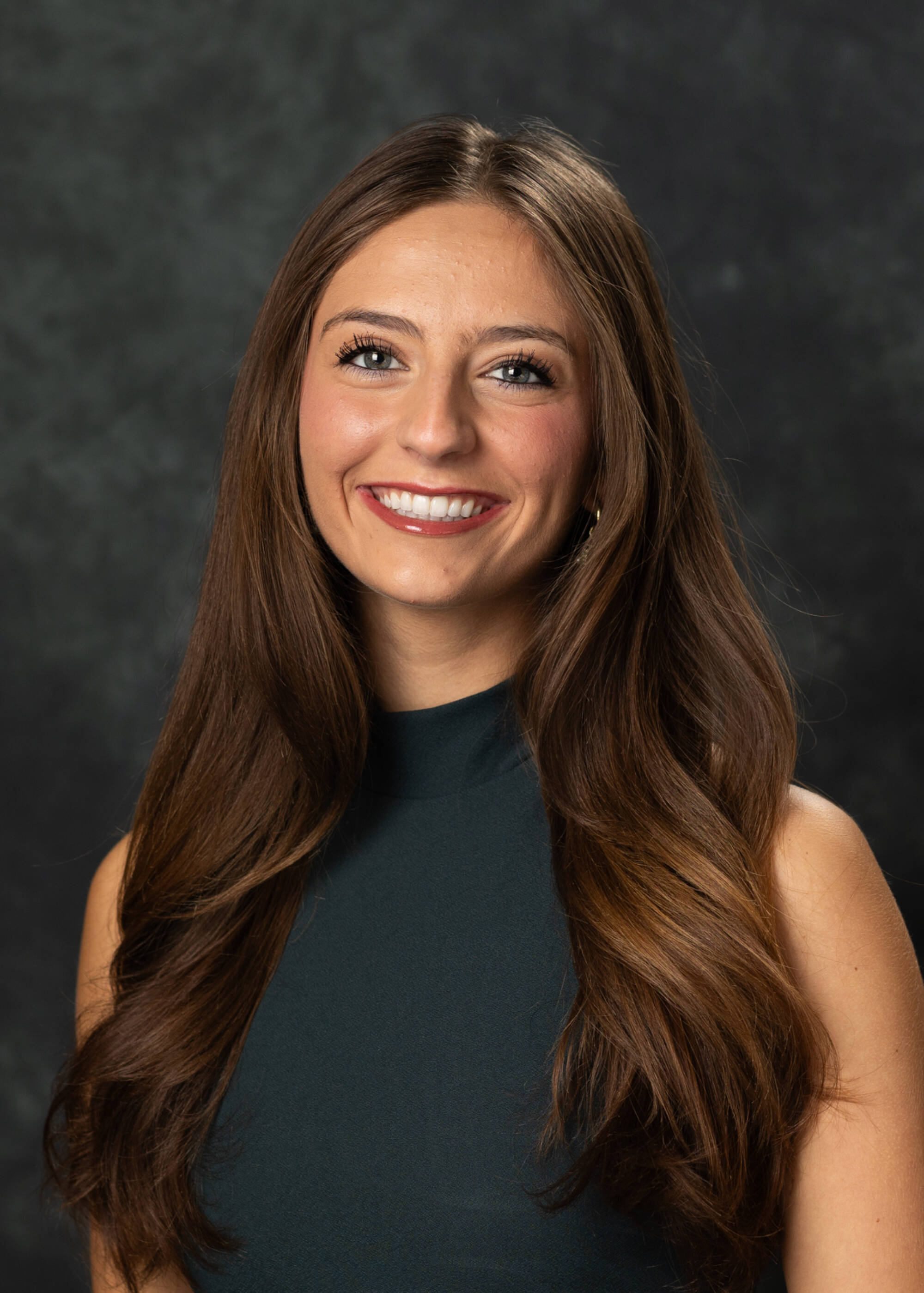 Bella Frikken smiling in a black top